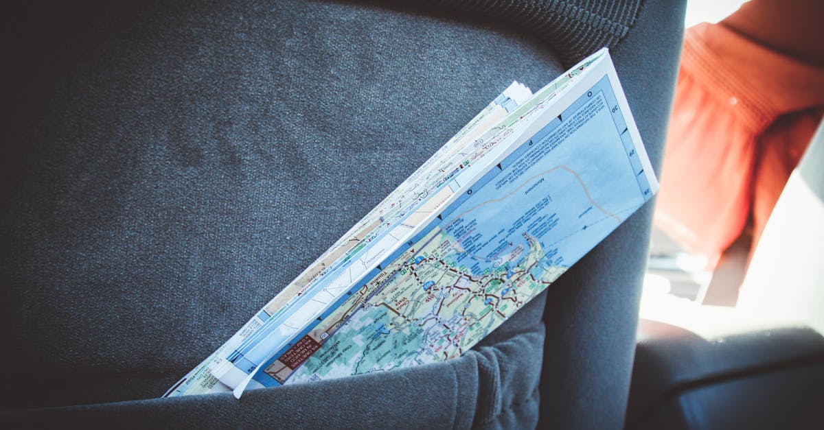 A folded map in a car seat pocket, perfect for planning a road trip.