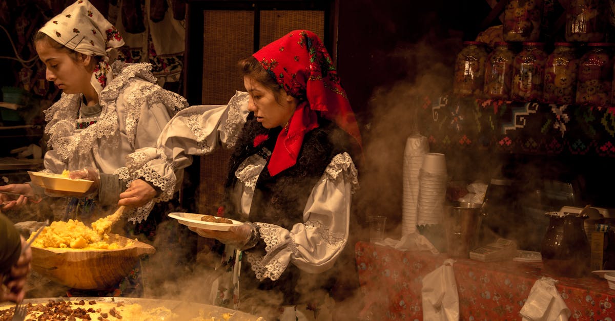 Women in traditional clothing serving food at a Romanian festival in Timișoara.