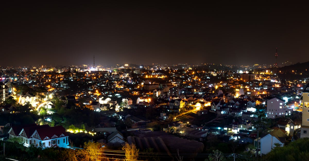 Stunning nighttime cityscape with glowing lights and a clear sky.
