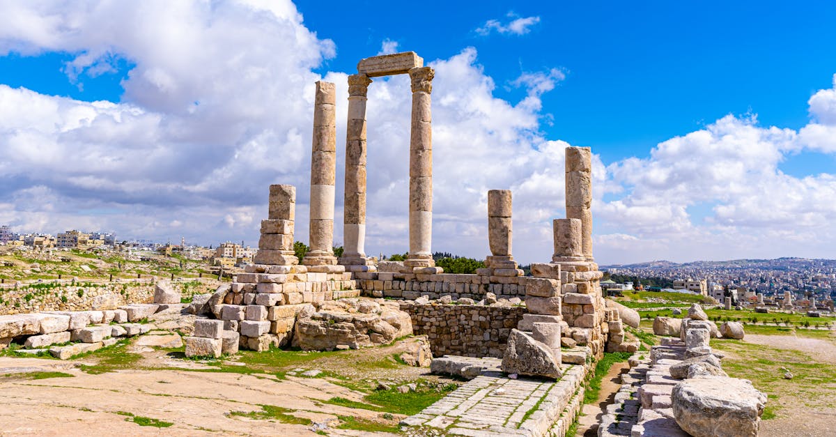 View of the ancient Temple of Hercules at the Amman Citadel under a clear blue sky.