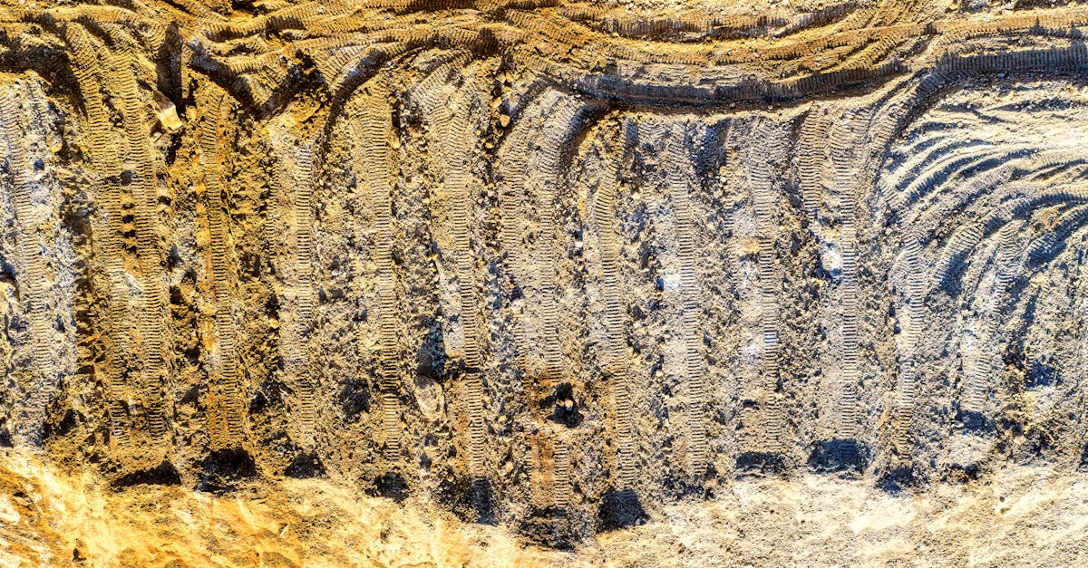 Aerial view of construction site showing machinery tracks and soil patterns in Rochester, MN.