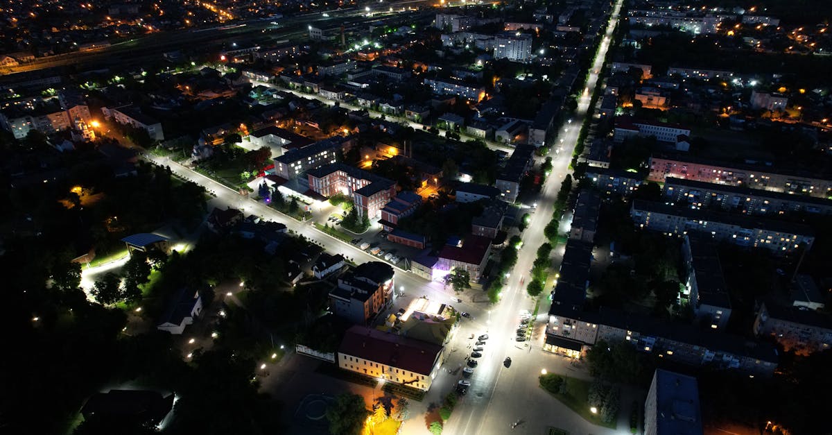 Discover the urban landscape of Kovel, Ukraine at night with its vibrant city lights from an aerial perspective.
