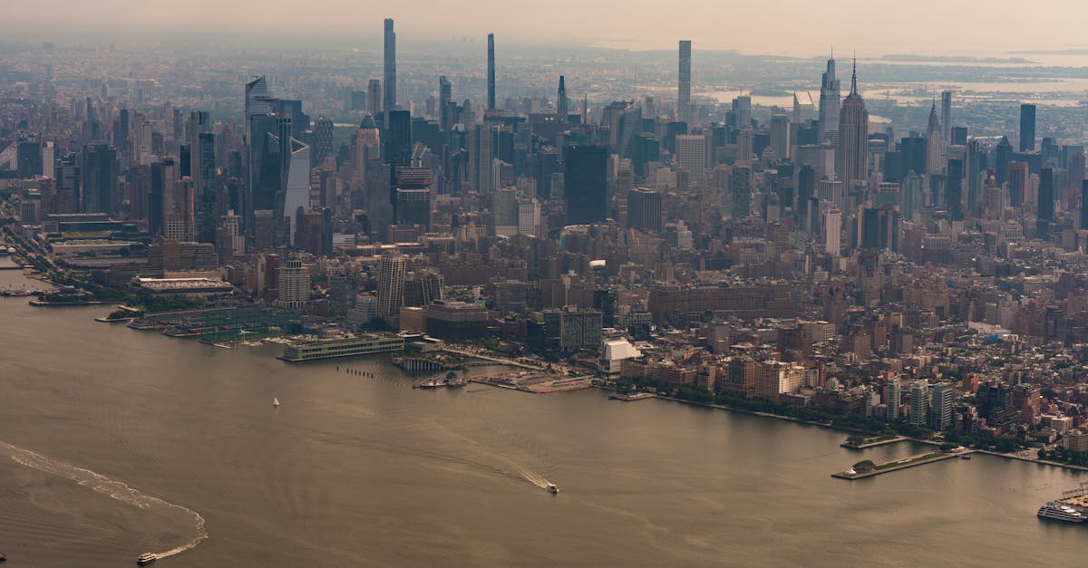 A stunning aerial view of New York City's iconic skyline and river.