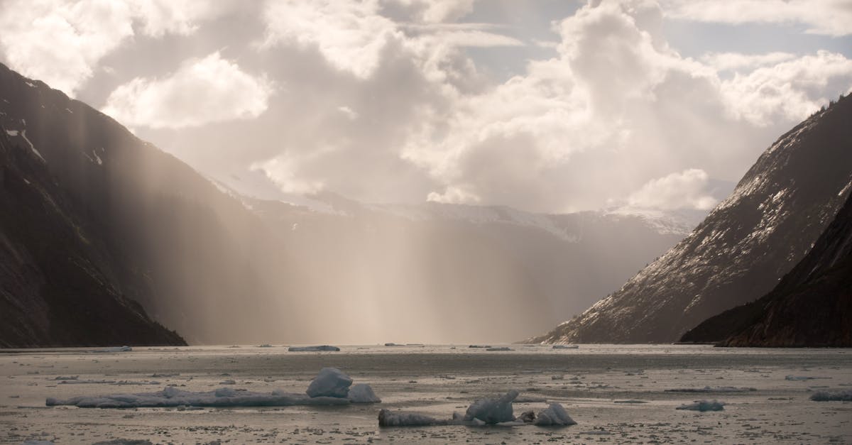 Captivating view of icebergs and glaciers under a dramatic sky in Juneau, Alaska.