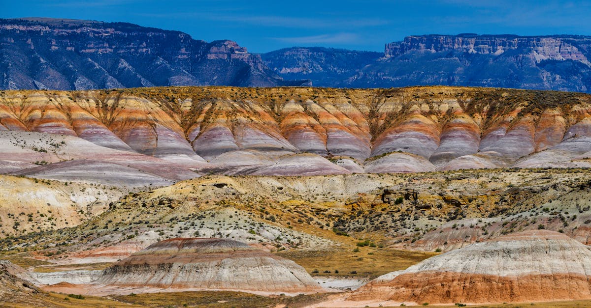 Vibrant multi-layered strata in scenic desert mountain range.