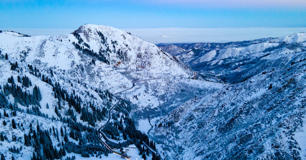 Breathtaking aerial shot of snowy mountains in Medeu, Kazakhstan during winter.