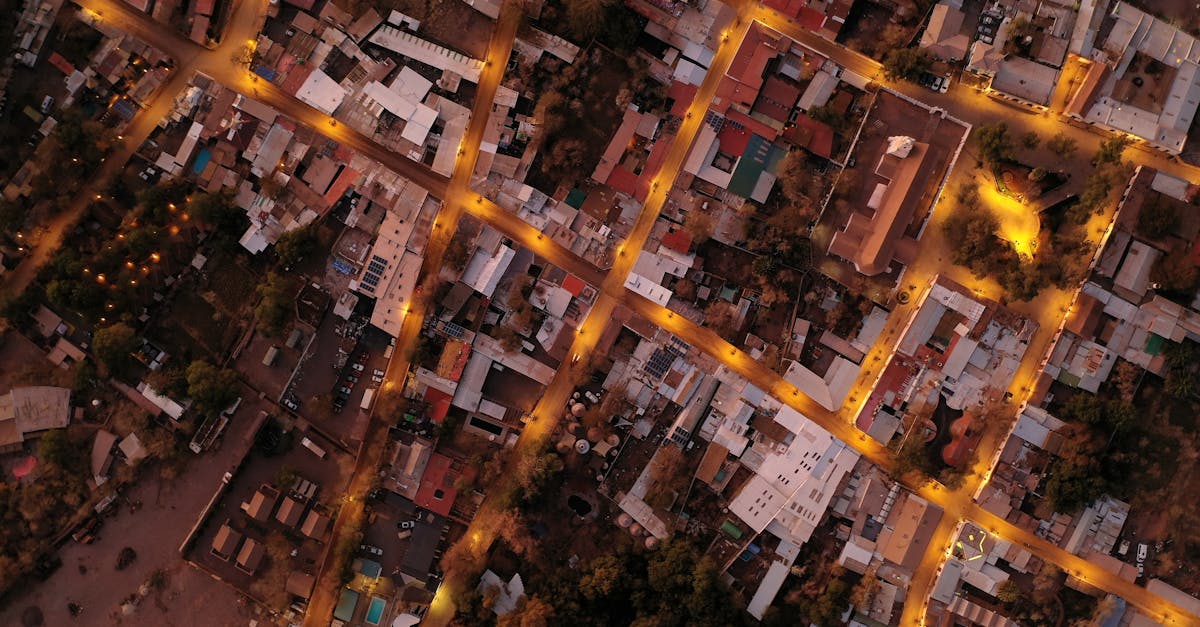Illuminated aerial cityscape of San Pedro de Atacama, showcasing street lights and urban layout at night.