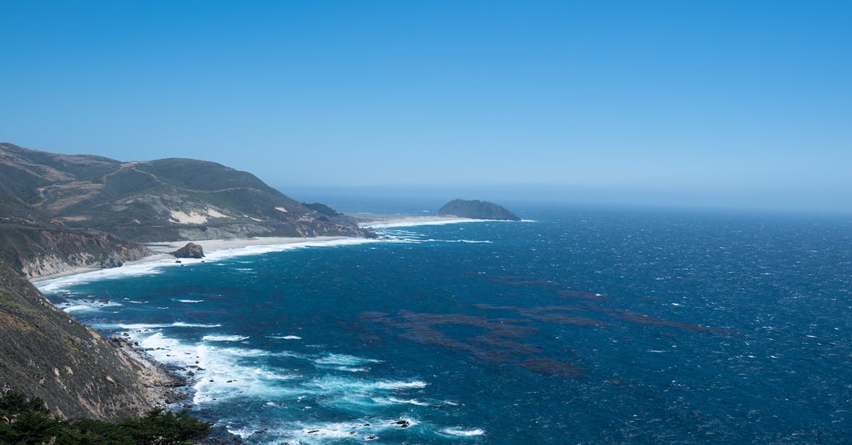 Explore the stunning coastline of California with waves crashing along rugged cliffs.