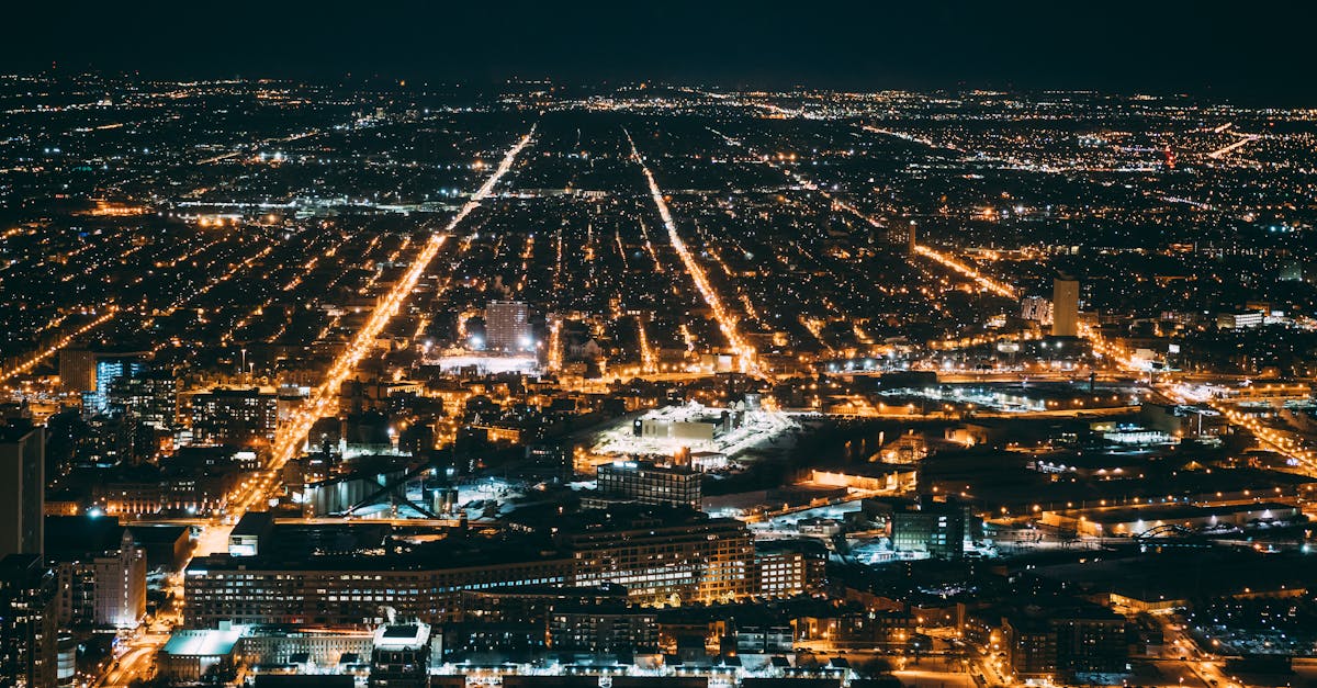 A breathtaking aerial view of a cityscape illuminated at night, showcasing urban beauty and vibrant city lights.