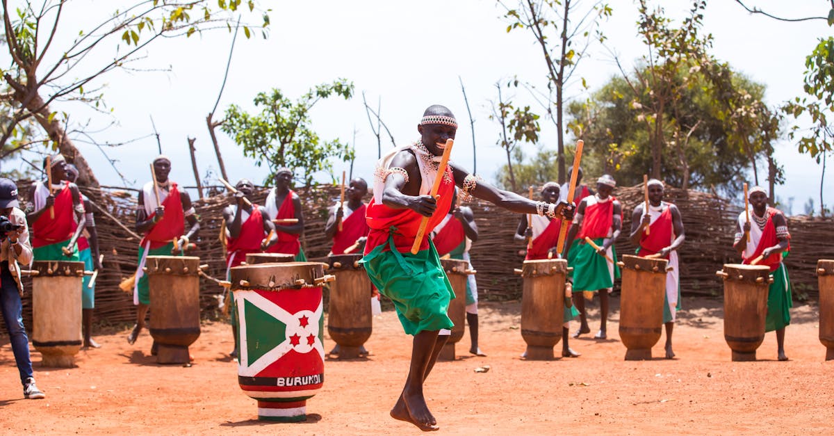 Vibrant outdoor performance by traditional Burundian drummers in cultural attire, celebrating heritage.
