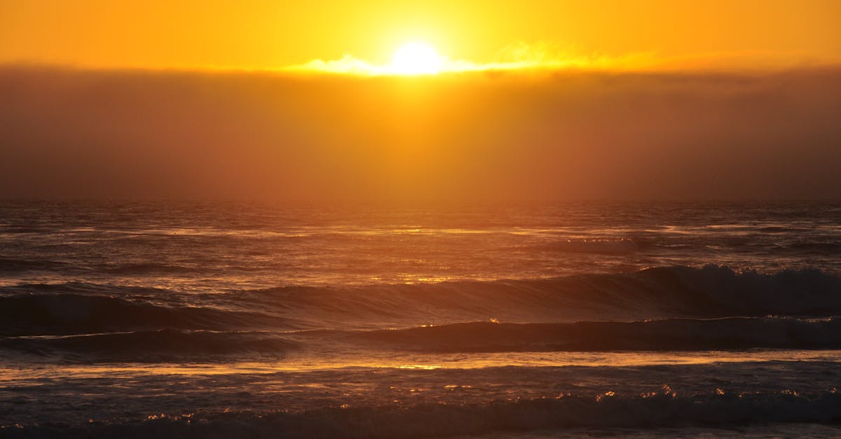 Stunning golden hour sunset over the ocean waves at Morro Bay, California.