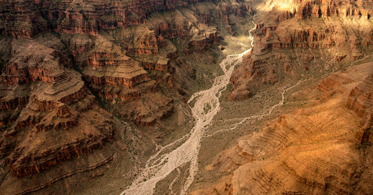 Stunning aerial view of the Grand Canyon's dramatic cliffs and winding river channels.