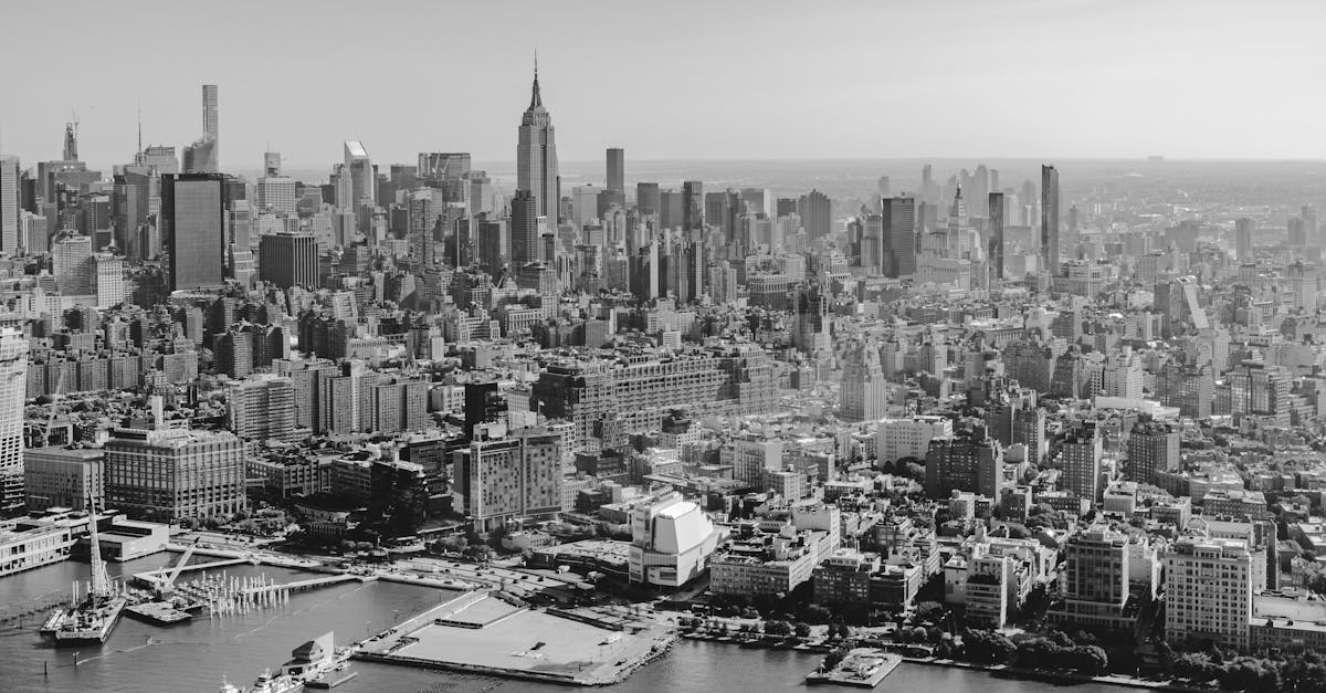 A stunning aerial black and white view of the New York City skyline featuring the Empire State Building.
