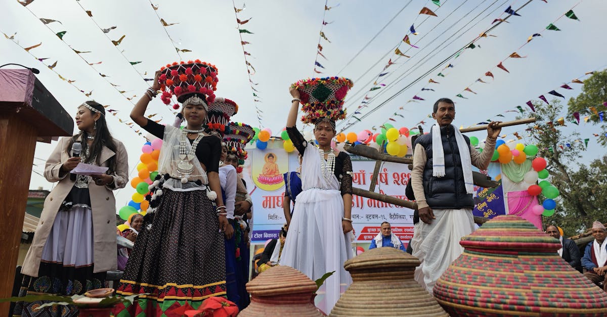 Cultural festival featuring vibrant traditional attire and decorated pots in a lively outdoor setting.