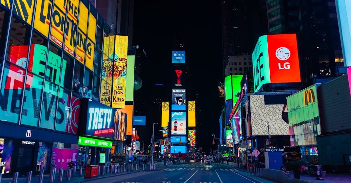 Illuminated billboards and vibrant street life in Times Square, New York City at night.