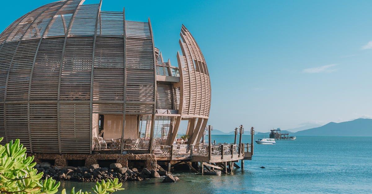 Modern wooden resort set against the serene tropical sea in Vietnam.