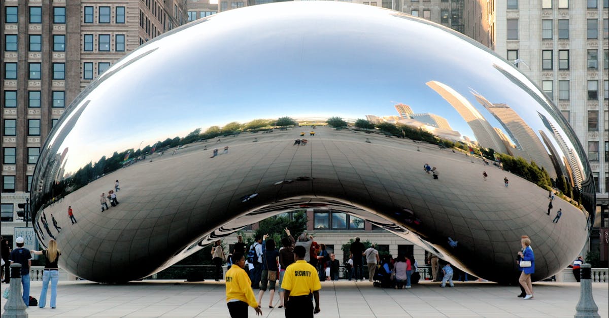 People gather around the iconic Cloud Gate sculpture in Chicago's Millennium Park.