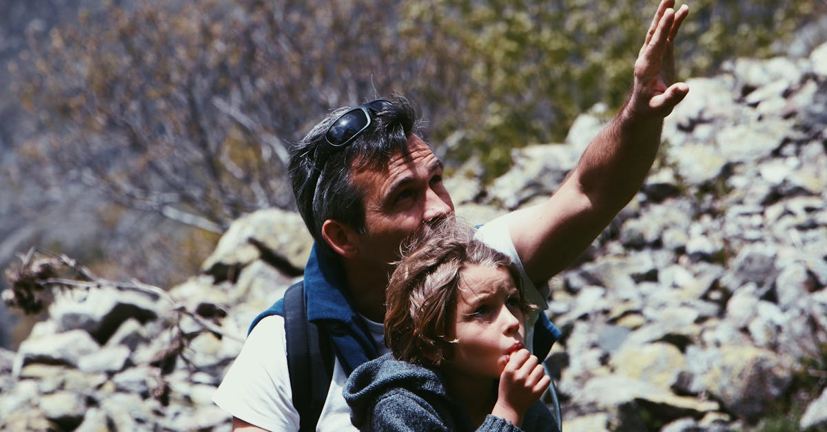 Father and child enjoying an adventurous hike in Champoléon, Provence-Alpes-Côte d'Azur.