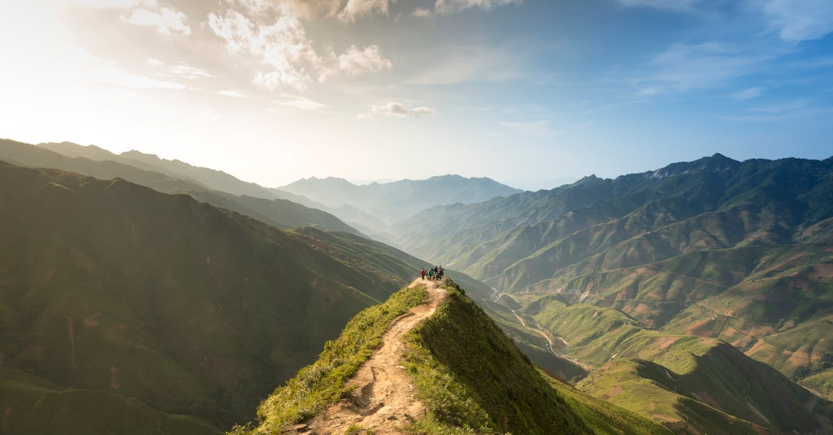Breathtaking view of a mountain trail under a vibrant sunrise, showcasing natural beauty.