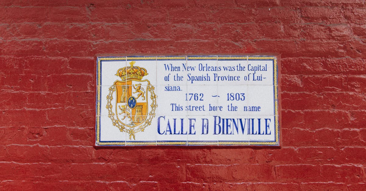 Street sign on a red brick wall, New Orleans, Spanish era history.