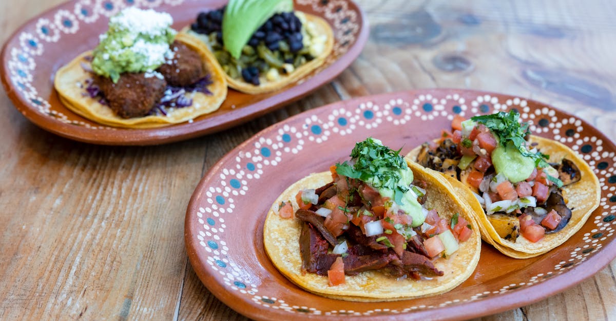 Delicious authentic Mexican tacos served on artistic plates, perfect for a traditional dining experience.