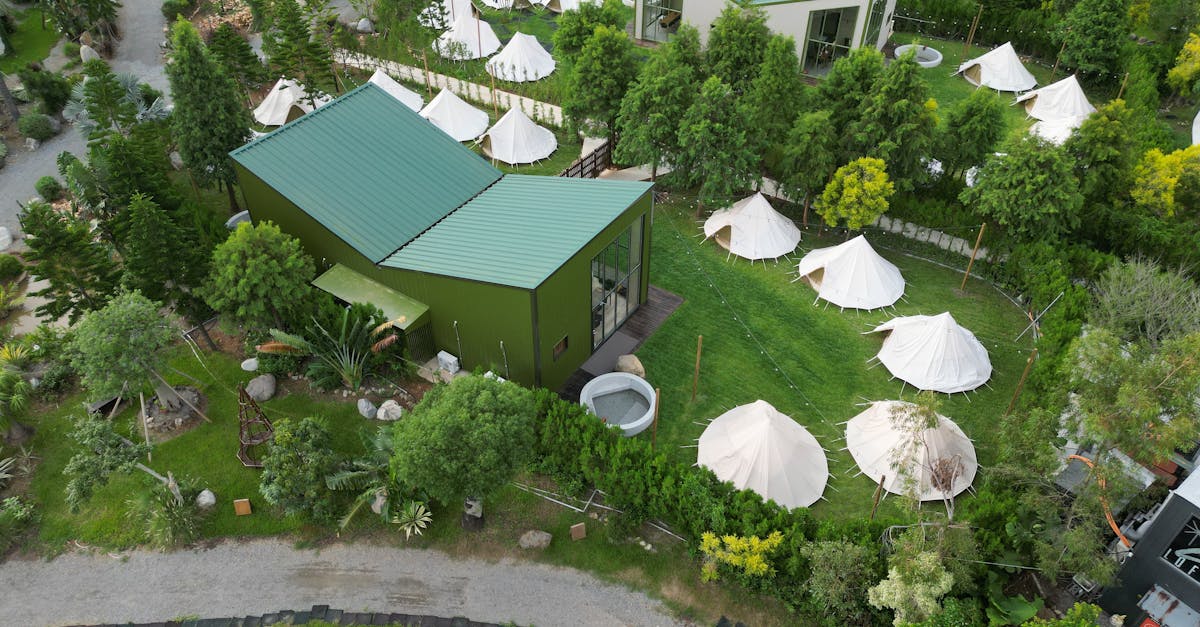 Bird's-eye view of a glamping area with modern architecture and lush greenery in Miao-li County, Taiwan.