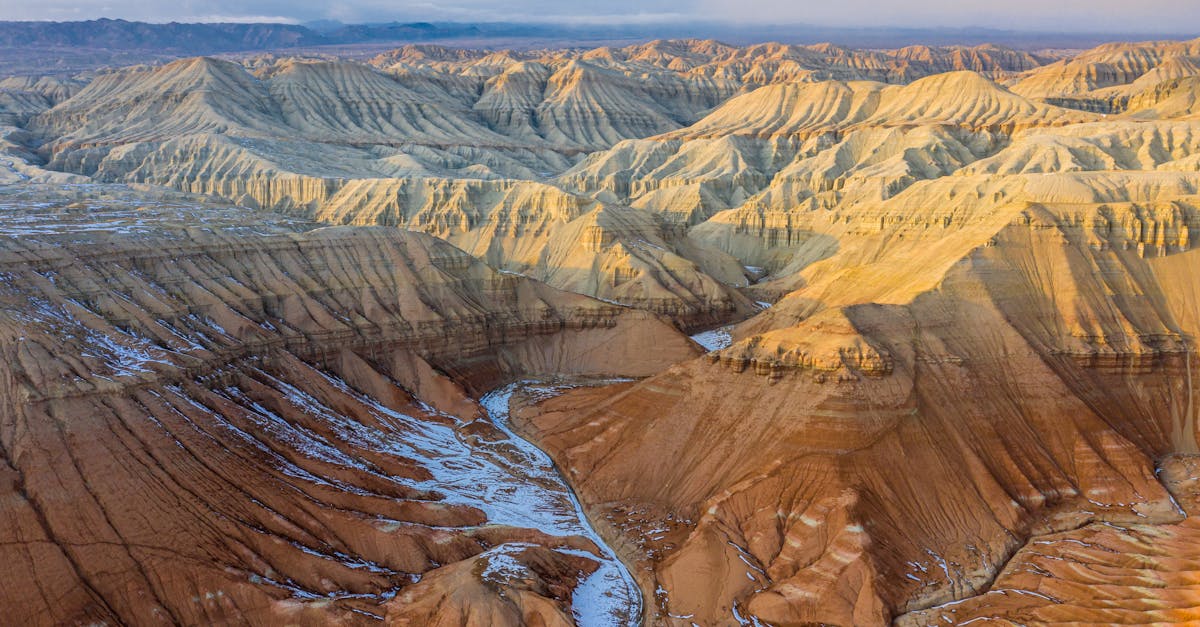 Explore the breathtaking landscape of Almaty's eroded canyons captured in a stunning aerial view.
