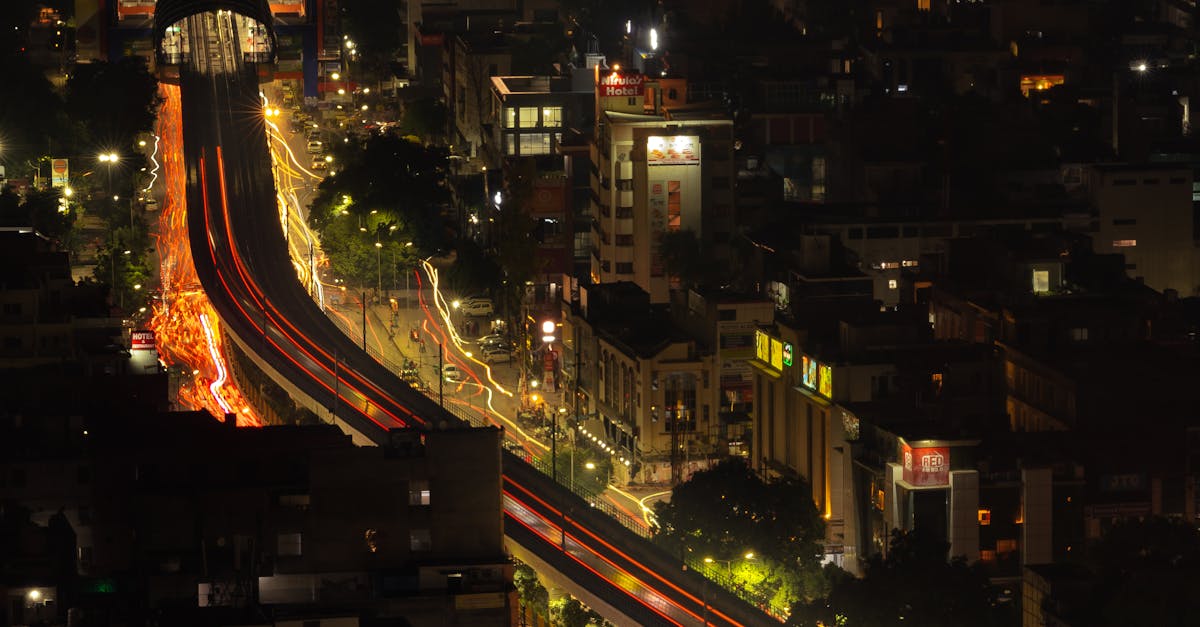Long exposure cityscape of vibrant Delhi streets at night.