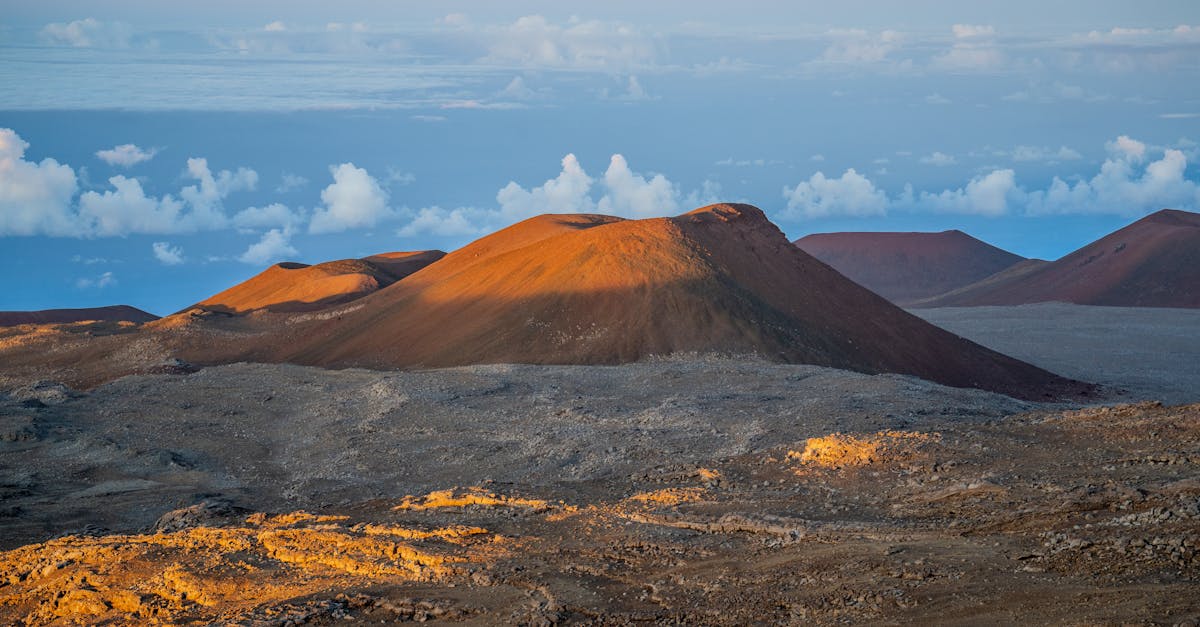 Stunning view of Mauna Kea in Hawaii during sunset, capturing volcanic beauty under a vibrant sky.
