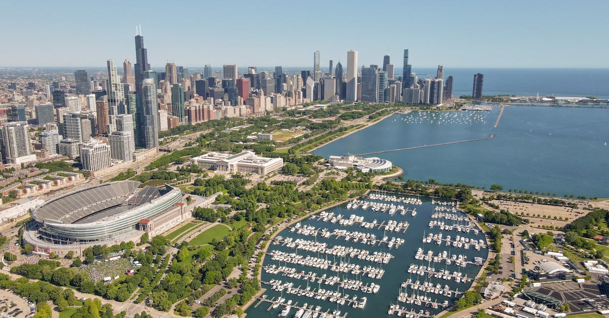A stunning aerial shot of Chicago's skyline and Lake Michigan with Soldier Field in sight.