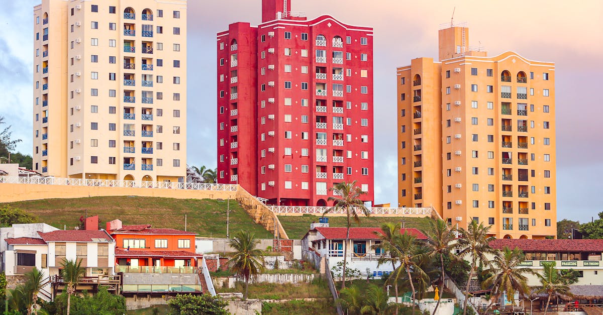Colorful high-rise buildings overlooking a tropical beach in Natal, Brazil, showcasing urban coastal architecture.