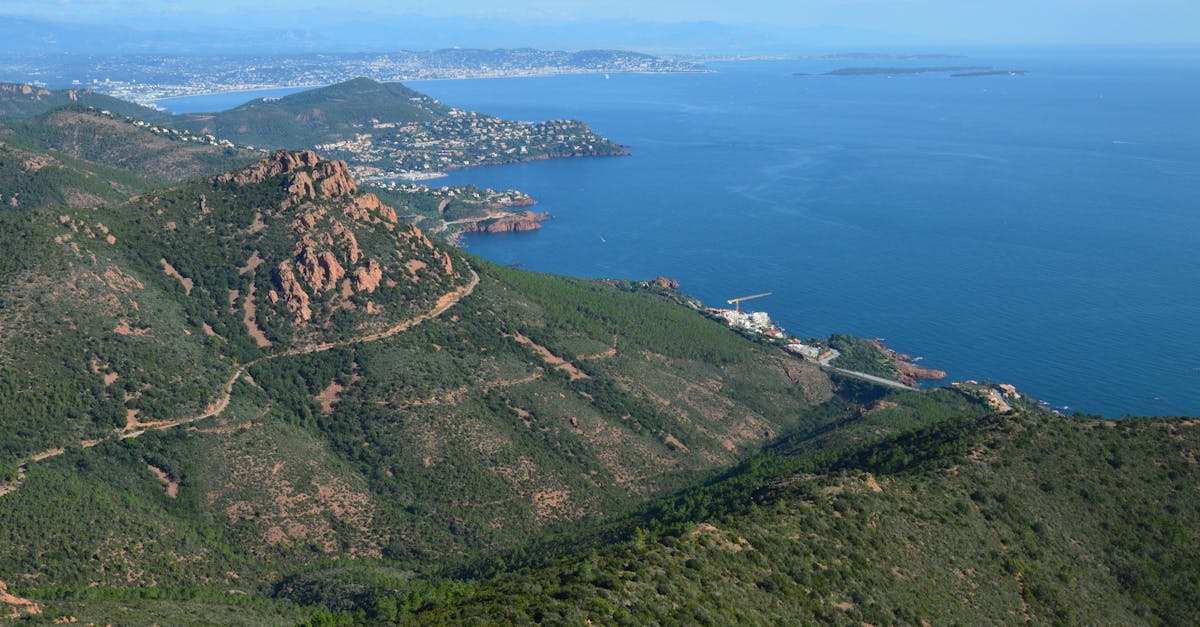 Stunning view of the Saint-Raphaël coastline in Provence, France with lush hills and blue waters.