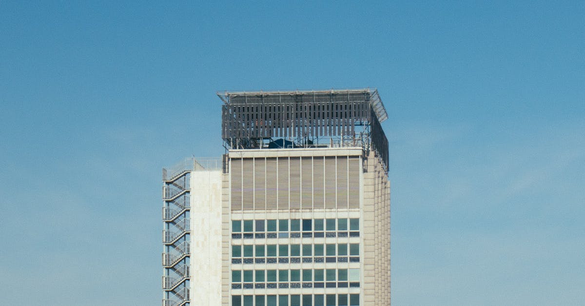 Minimalist shot of a modern high-rise building with clear blue sky background