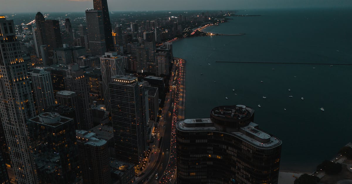 A stunning aerial view of Chicago's skyline and Lake Michigan during twilight, showcasing the city's architecture.