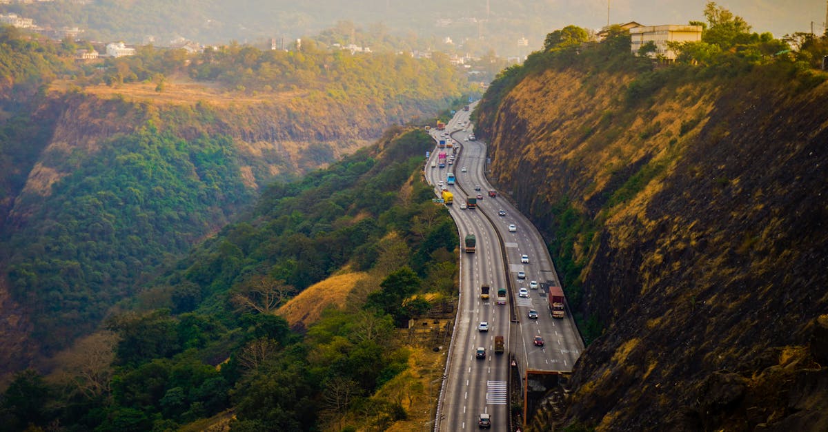 A scenic view of a busy highway winding through the lush hills of Lonavala, Maharashtra, India.
