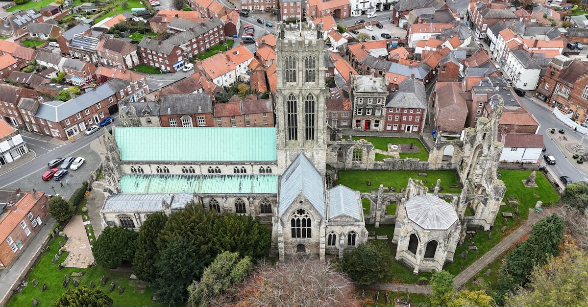 Aerial view of the historic Beverley Minster surrounded by quaint English townhouses.
