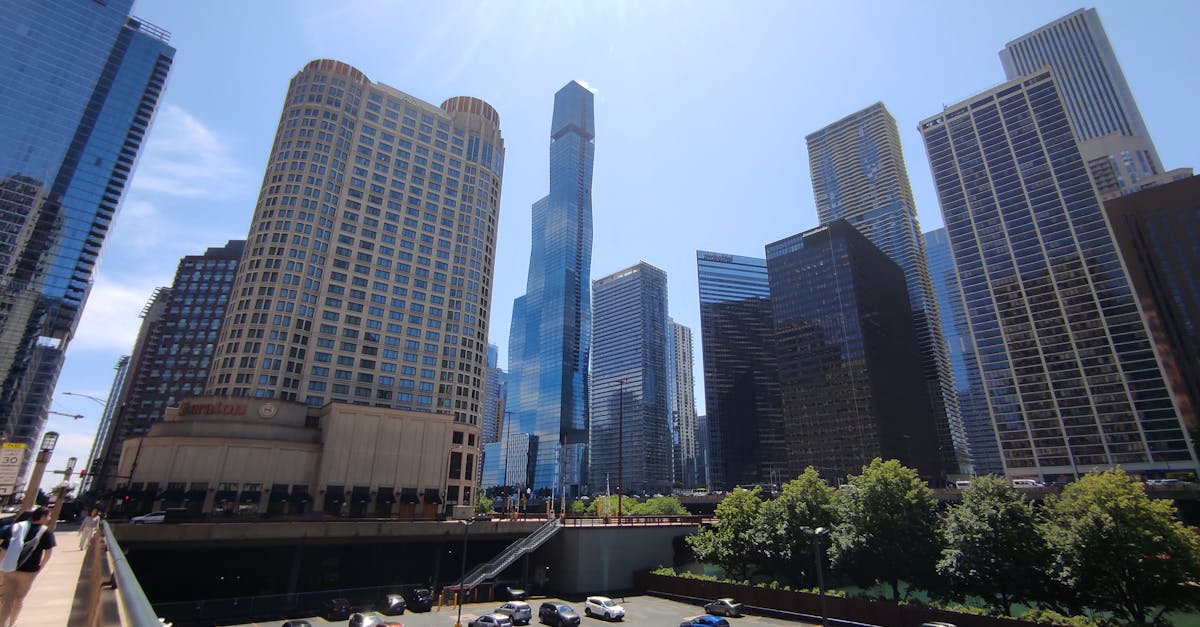 View of Chicago's towering skyscrapers and modern architecture on a sunny day.
