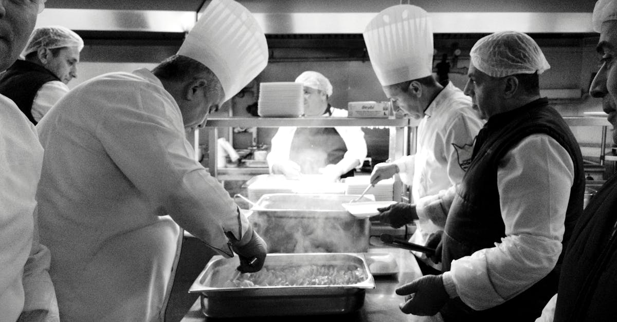 Chefs at work in a bustling kitchen in Istanbul, creating culinary magic in black and white.