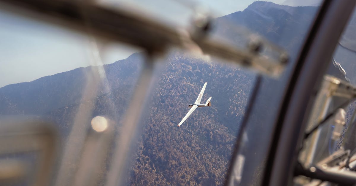 A glider flying over the scenic Andes Mountains near Santiago, Chile, showcasing aerial adventure.
