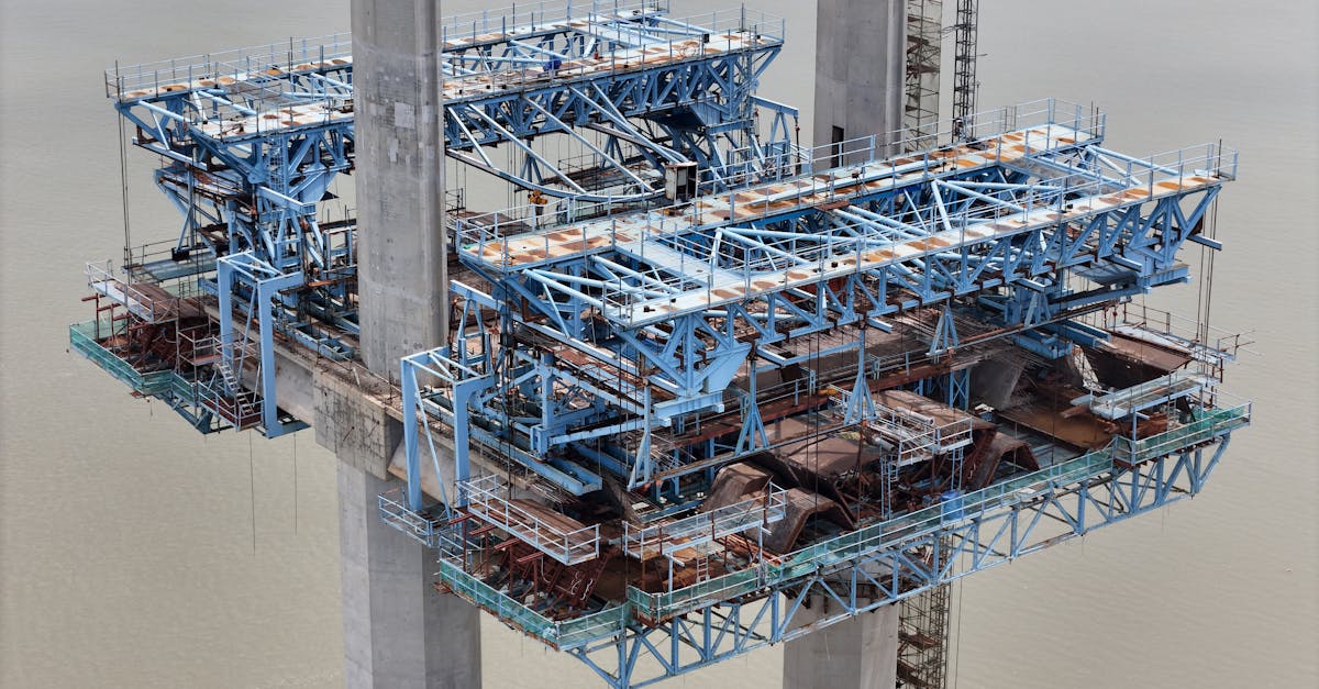 Detailed view of a massive industrial bridge structure under construction, displaying robust engineering.