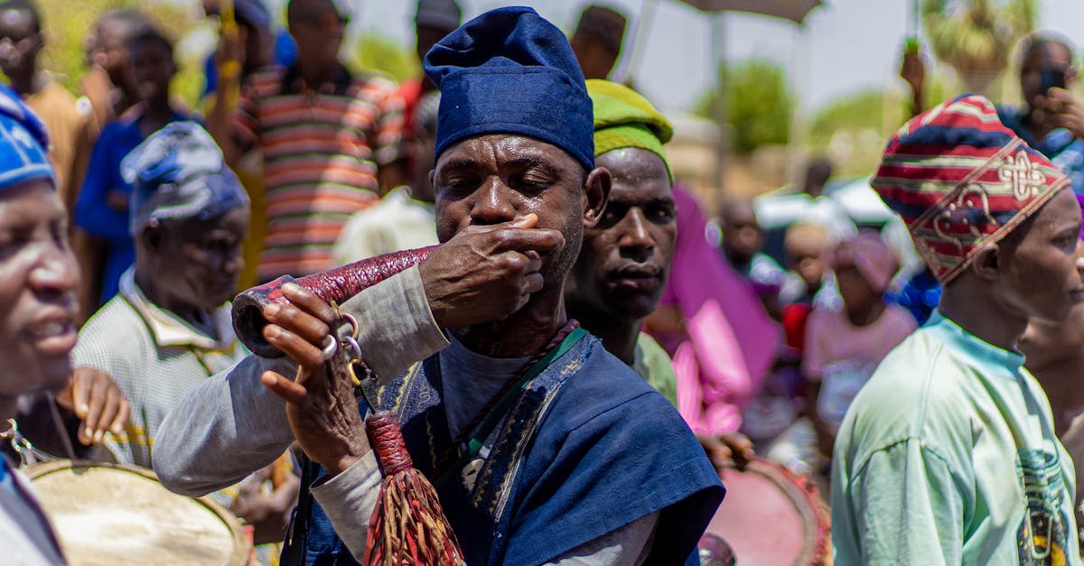 Vibrant scene of musicians playing traditional instruments at a cultural outdoor event.