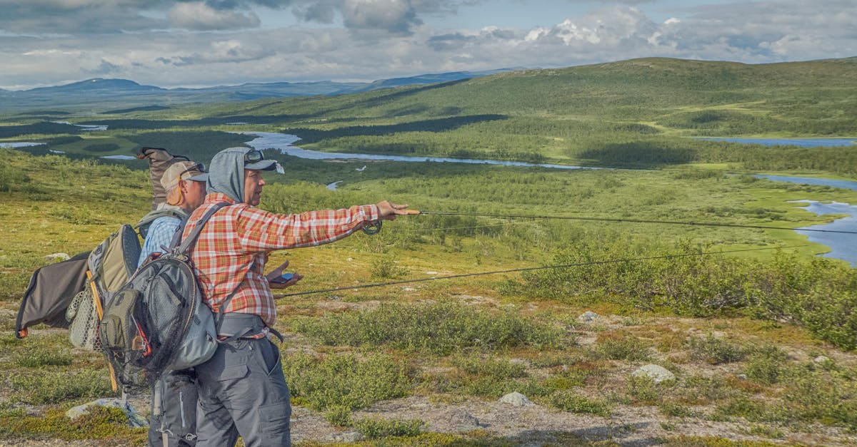 Two anglers prepare for a fishing trip amidst the breathtaking landscapes of Finnmark, Norway.