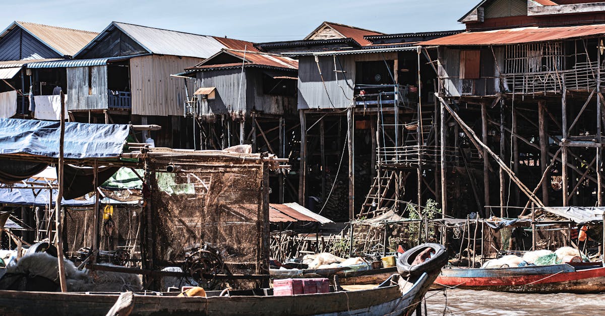 Traditional stilt houses in Kampong Phluk, Cambodia, showcasing unique riverfront architecture.