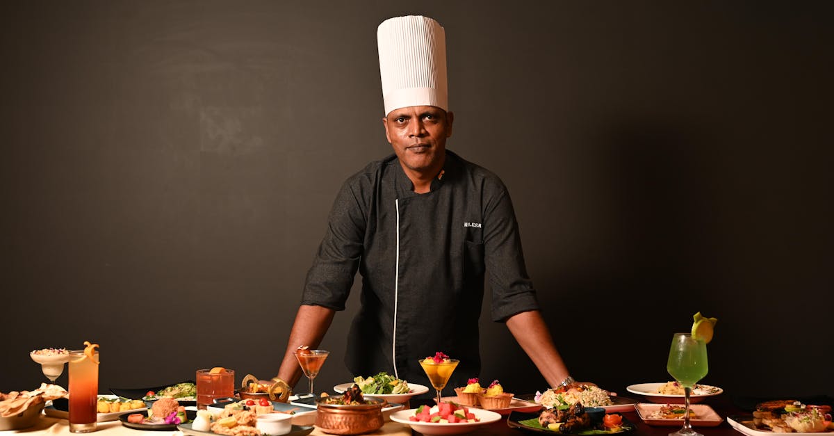 A skilled chef in Goa showcasing an array of gourmet dishes, highlighting Indian and fusion cuisine.