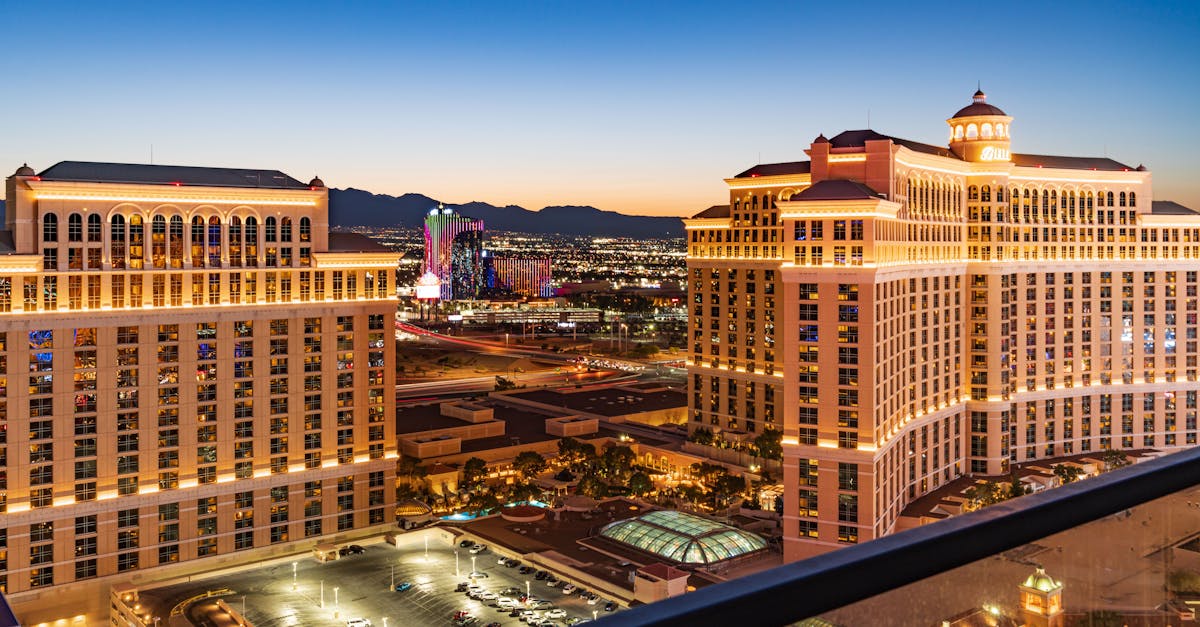 Stunning aerial view of the illuminated Bellagio Hotel and Las Vegas skyline during twilight.