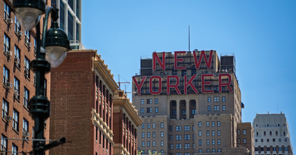 View of the New Yorker building in Manhattan against a clear blue sky.