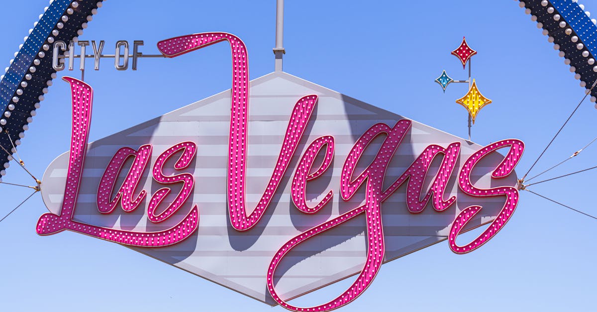 The famous Las Vegas sign with vibrant colors against a clear sky, a must-see landmark.