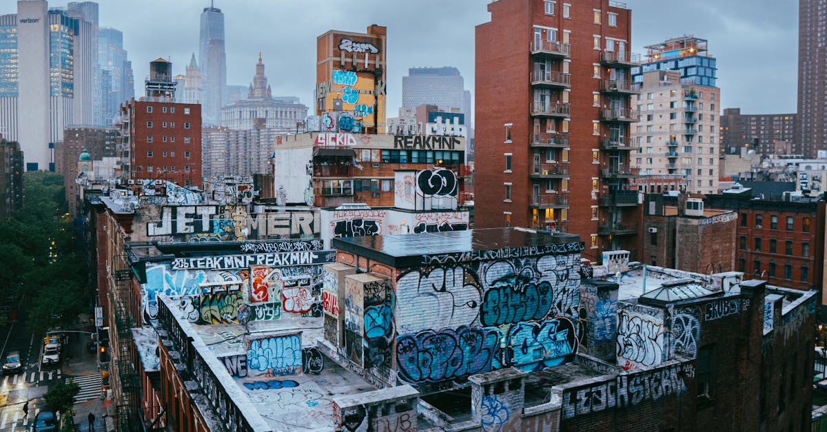 Dynamic scene of graffiti-covered rooftops in New York City's Manhattan.