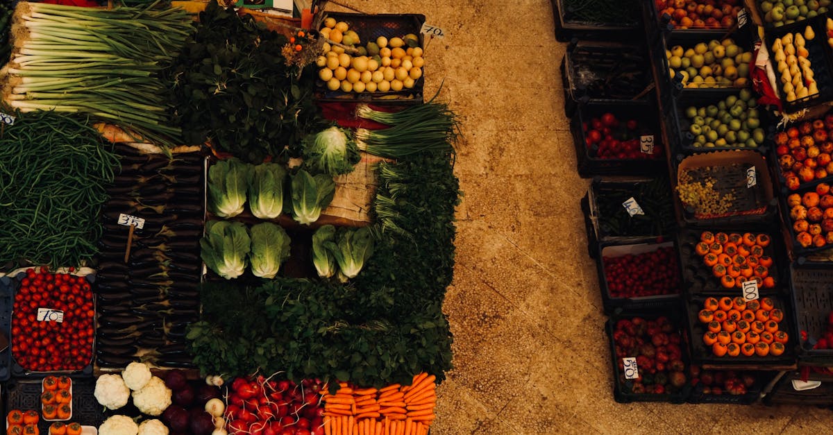 A vibrant aerial shot of a diverse array of fresh vegetables and fruits at a farmer's market.
