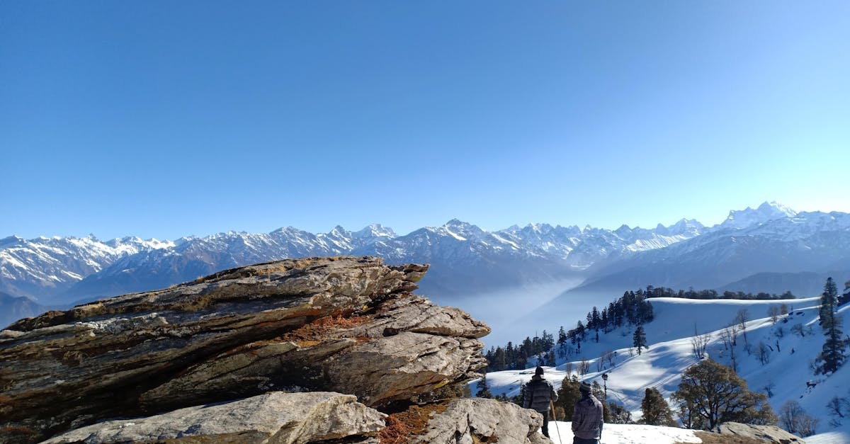 Majestic snowy mountains in Sankri capturing winter trekking vibes in the Himalayas.